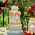 Opulent gold tiered wedding cake