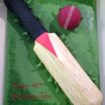 Cricket bat and ball birthday cake