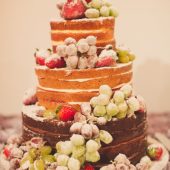 Three tiered indulgent party cake with fruit