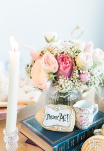 Books, candles and crockery go a logn way in the styling of an Alice in Wonderland event