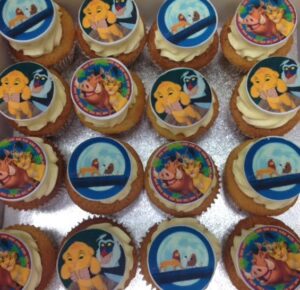 Edible sugar discs printed with images using edible ink on top of swirled buttercream cakes