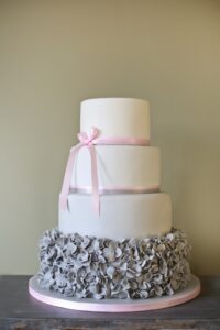 Grey and pink ruffle wedding cake