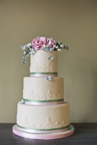 Eucalyptus and rose tiered wedding cake