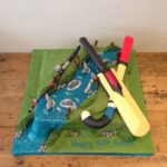 sports themed cake - hockey, cricket and fishing