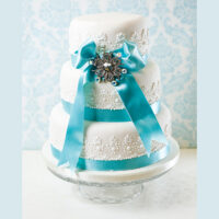 White with blue ribbon wedding cake