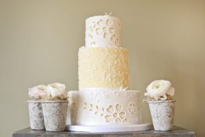 Yellow and white broderie anglaise wedding cake